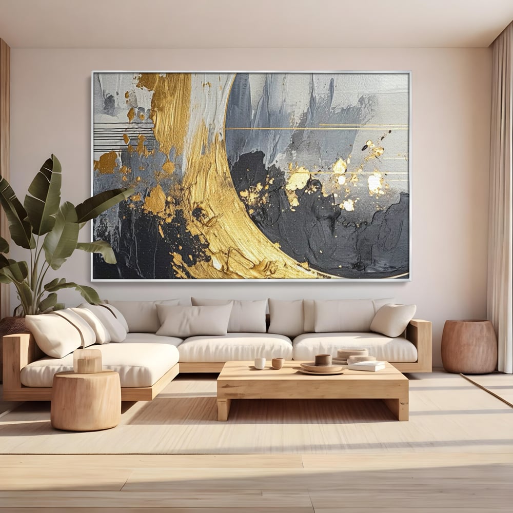 Tablou canvas cu pictura abstracta cu arc aurit si texturi gri, in rama de aluminiu argintiu, pe perete intr-un living